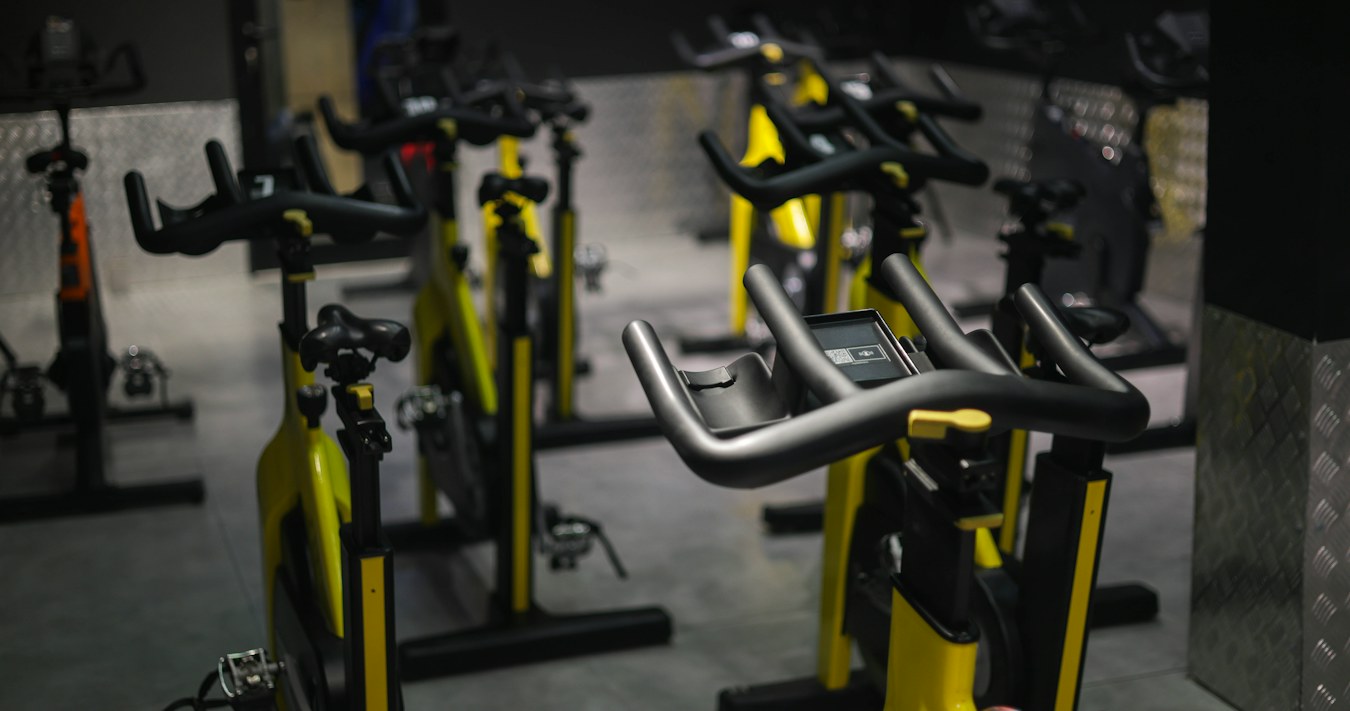 Row of spin bikes in a studio