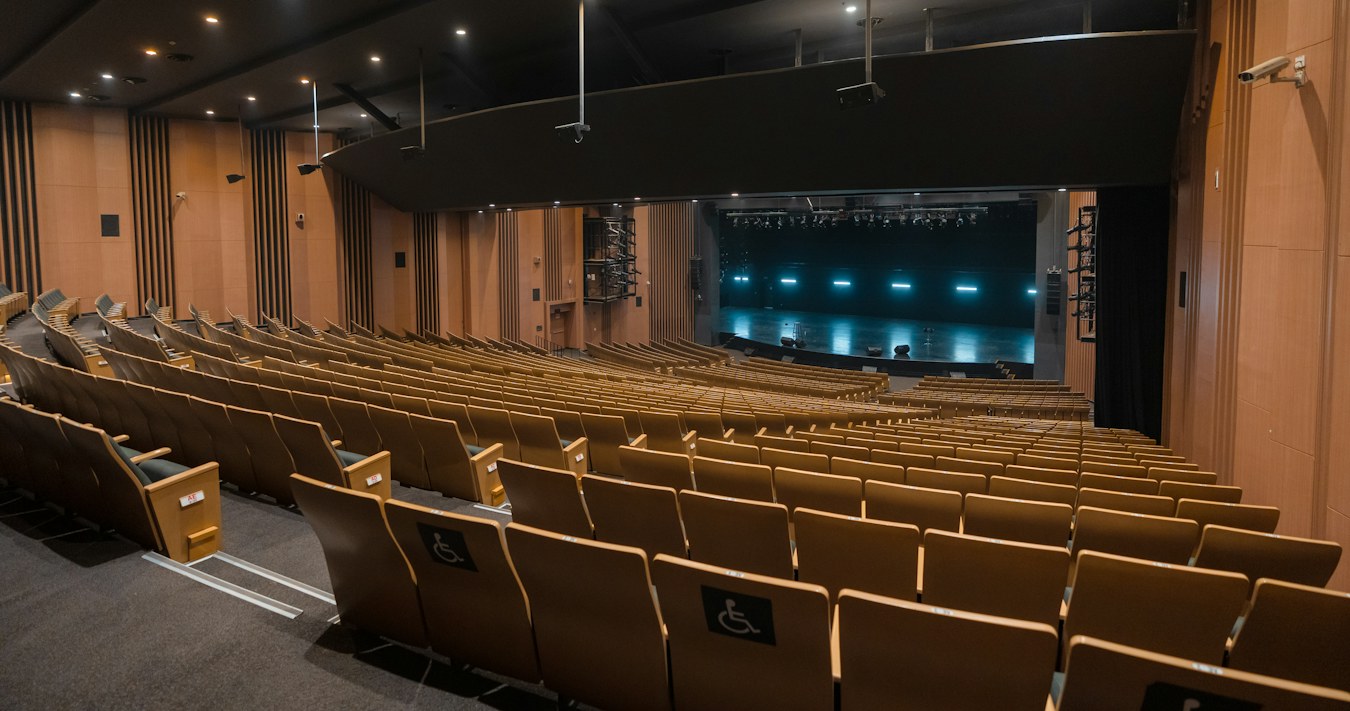 Empty auditorium with timber seating Empty auditorium with timber seating