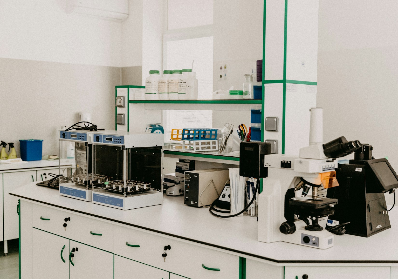 Laboratory bench with microscope and analytical equipment Laboratory bench with microscope and analytical equipment