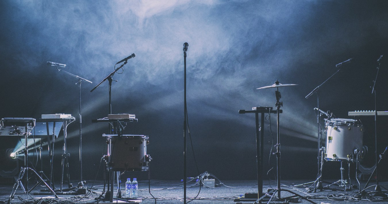 Music venue stage with instruments and lighting Music venue stage with instruments and lighting