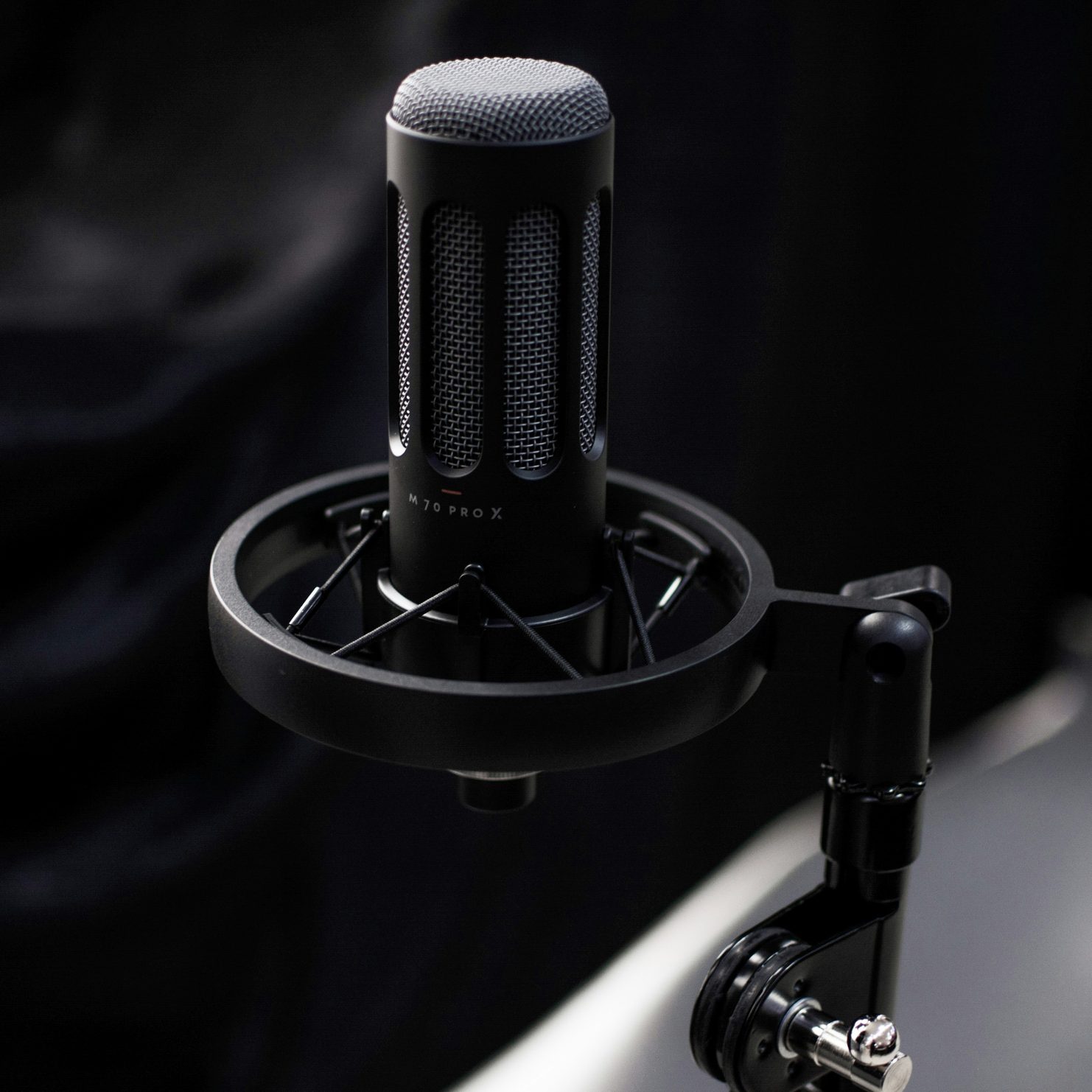 a close up of a microphone on a stand a close up of a microphone on a stand
