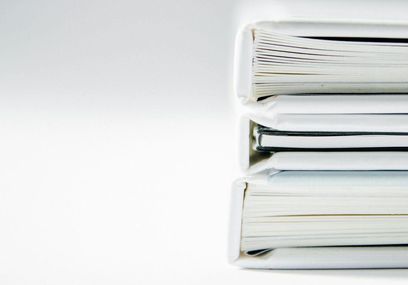 Stack of report folders Stack of report folders