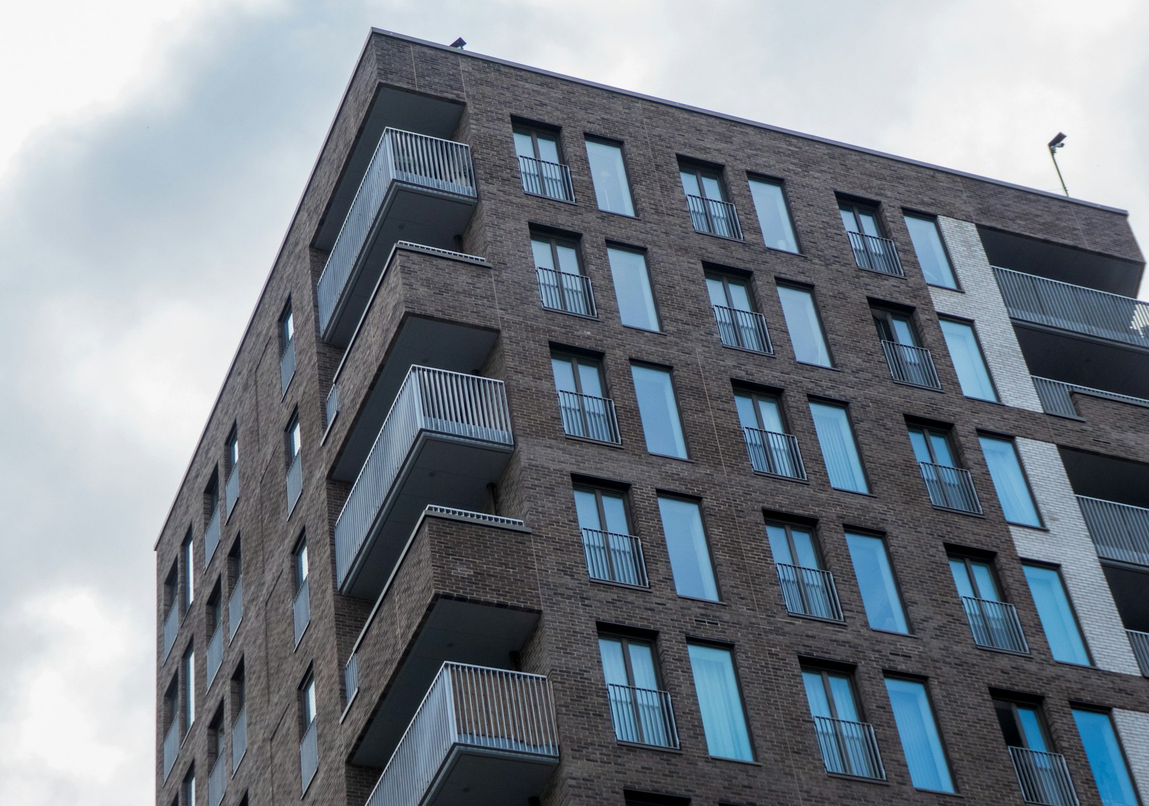 Brick apartment block with balconies Brick apartment block with balconies