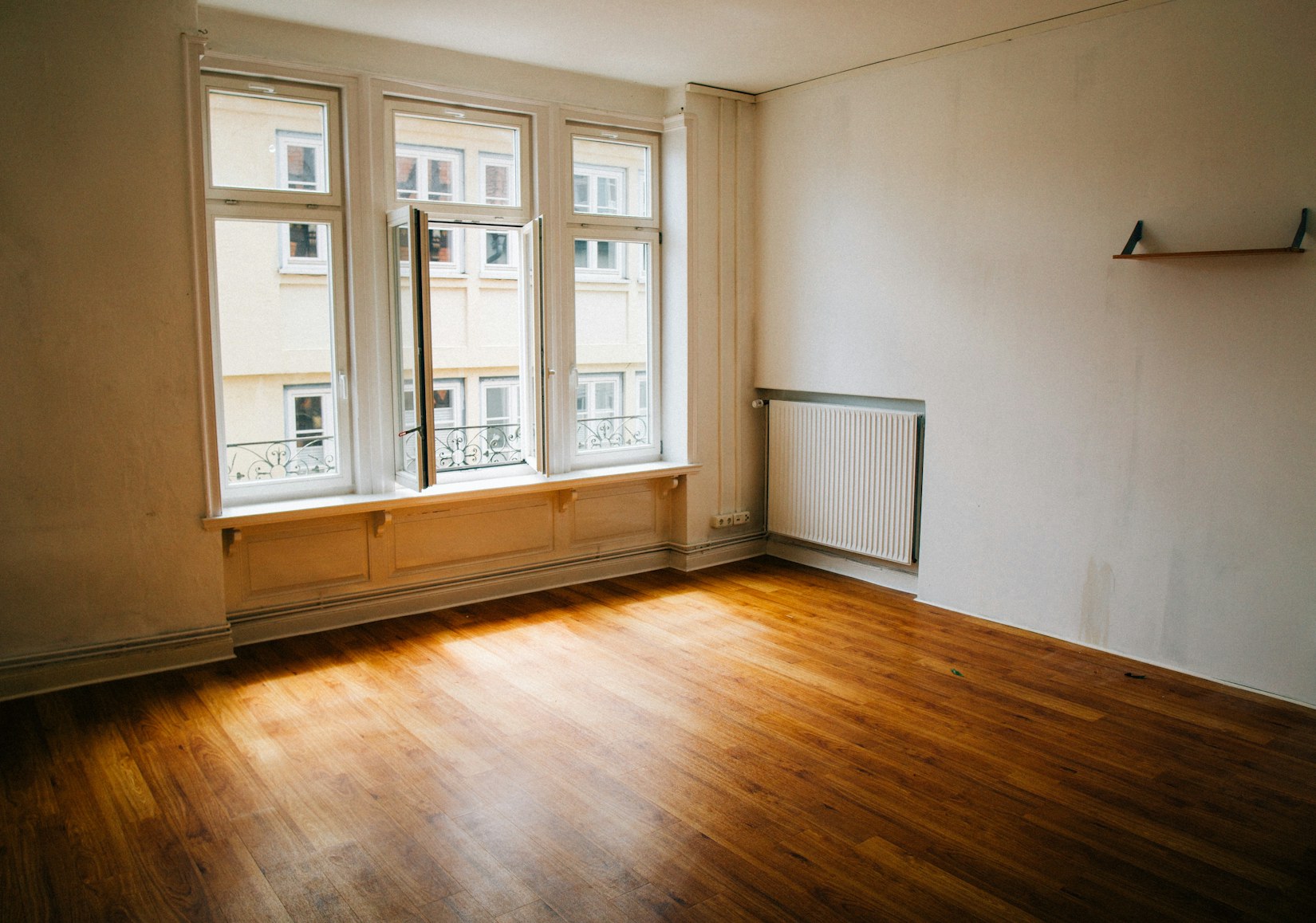 Empty room with timber floor before handover